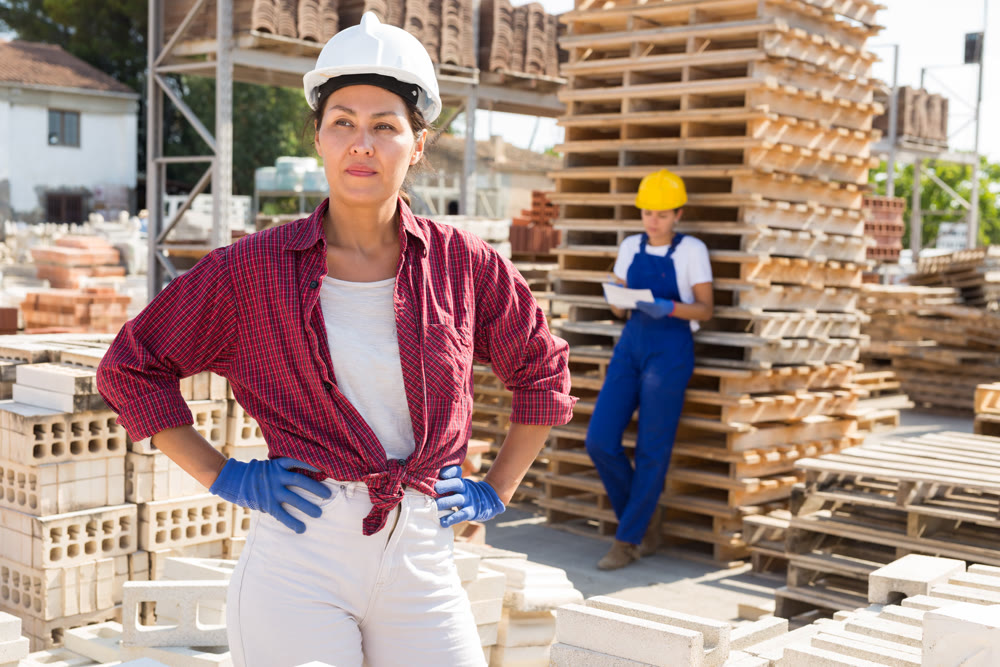 Asian female worker posing at construction store