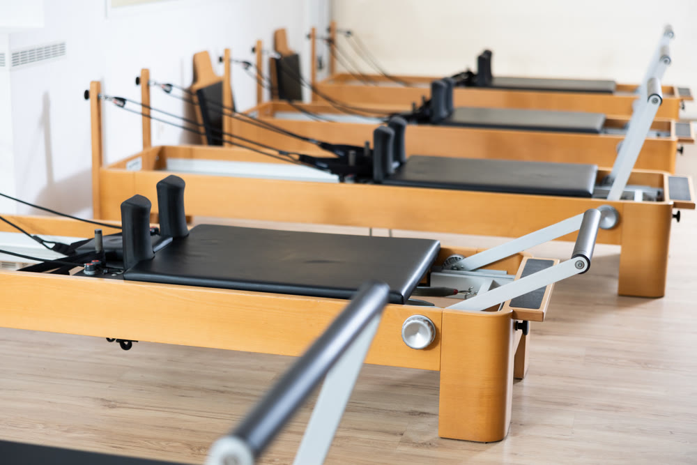 Reformer pilates studio machine for fitness workouts in sport gym