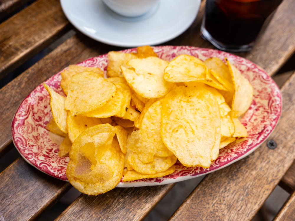 Traditional spanish appetizer Vermouth with chips close up