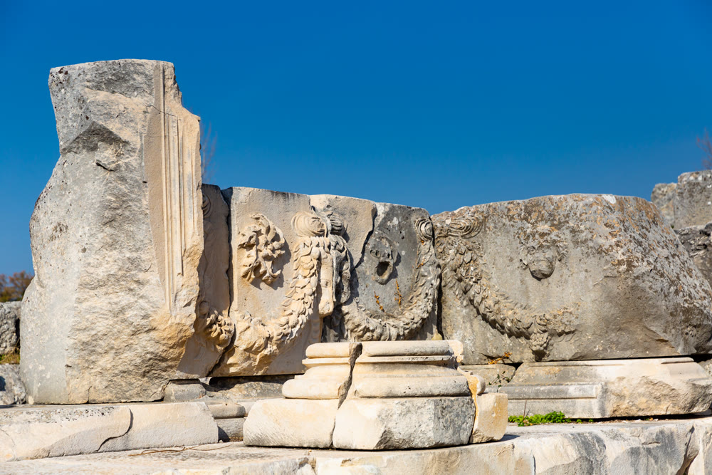 Remained sculptural details on Roman theatre ruins in Tlos, Turkey