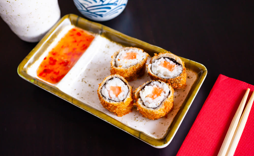 Portion of fried sushi maki with salmon