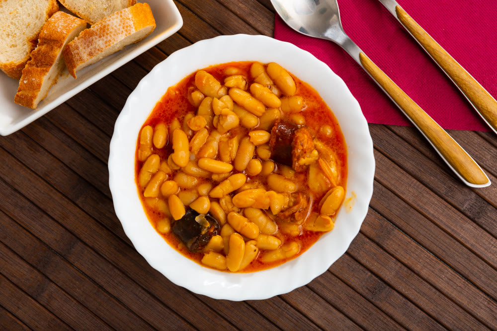 Tasty stew of asturian beans in gravy with sausages