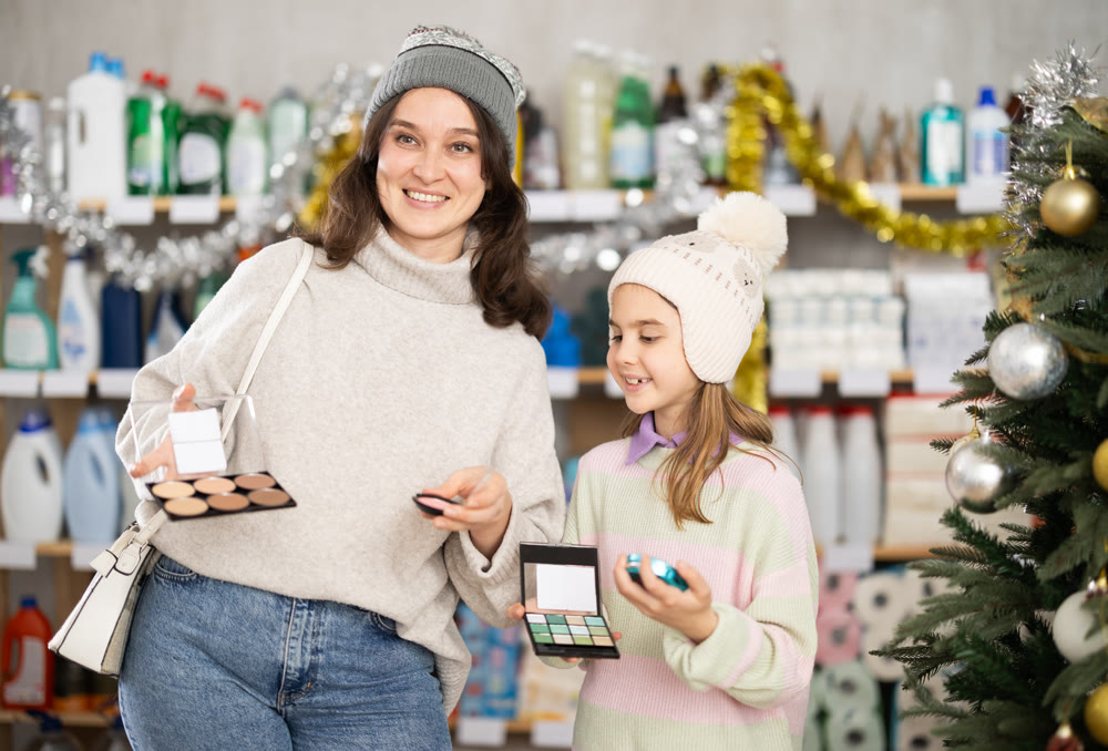 woman with a child chooses cosmetics