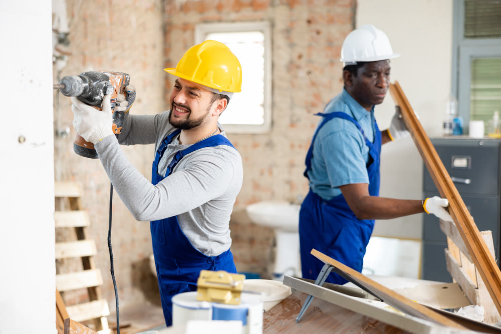 Team of workers is renovating a room in cottage
