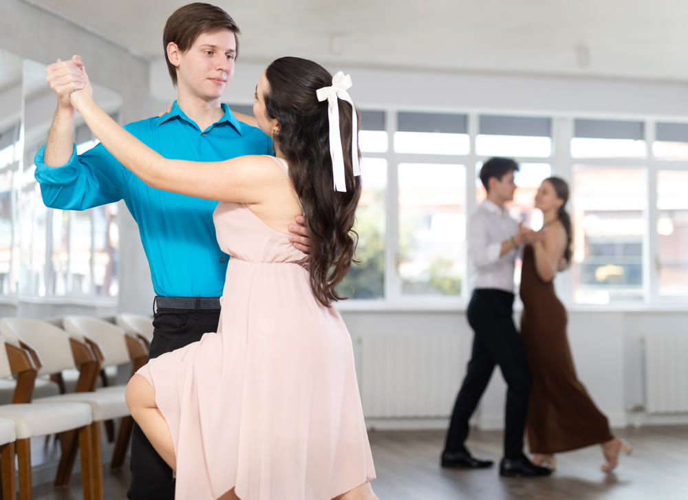 Couple young woman and man dancing tango