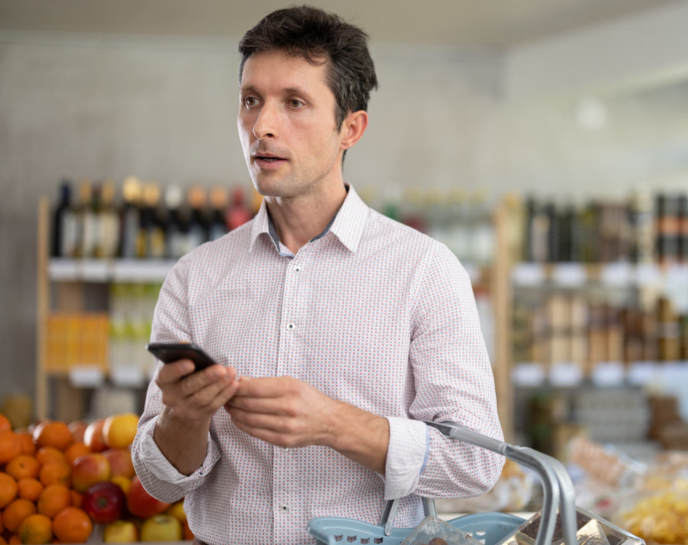 Man holding phone and recording audio