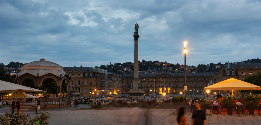 Evening cityscape of Historic Schlossplatz central square featuring Jubilee Column