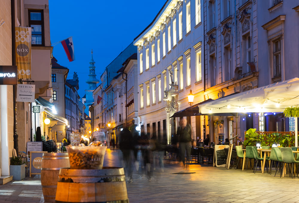 Evening view of Venturska Street with cafes and St. Michaels Gate, Bratislava