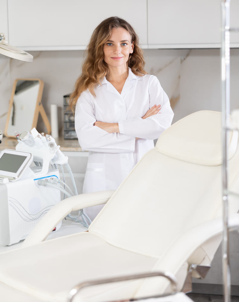 Young female doctor posing in medical room