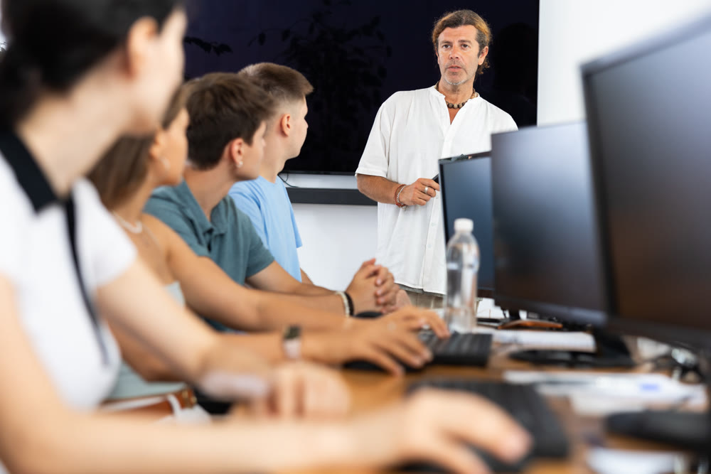 Male teacher enthusiastically explains
