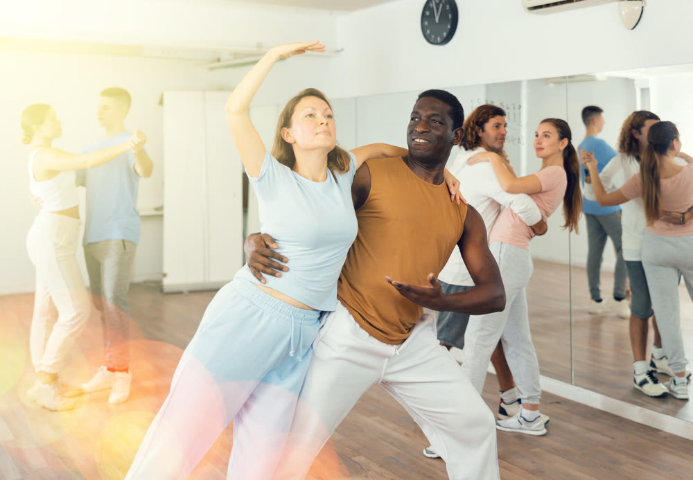 Adult female and adult male dancing pair dance