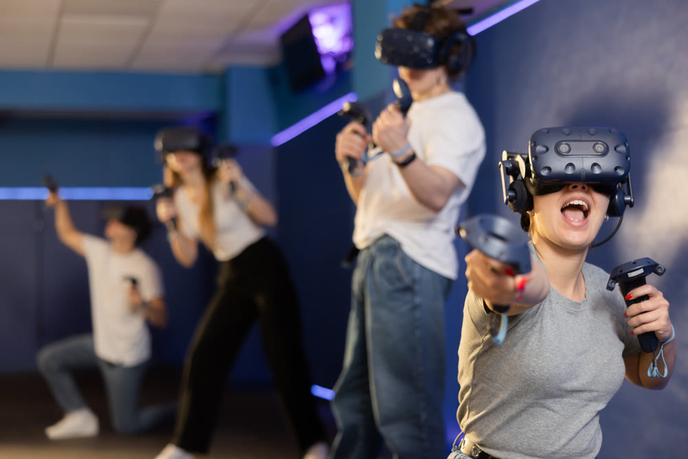 Friends using virtual reality glasses - people having fun with technology vr headset