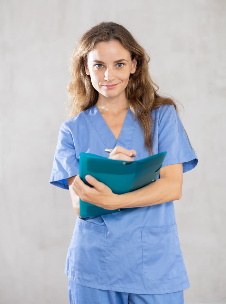 Young female doctor taking notes in studio