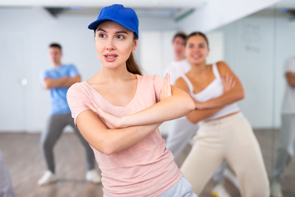Young girl learns dance in dance studio