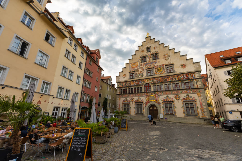 Town square with historic painted Altes Rathaus building in Lindau