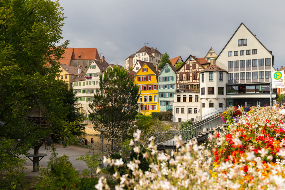 Neckar river waterfront with historic houses and Eberhardsbrucke bridge