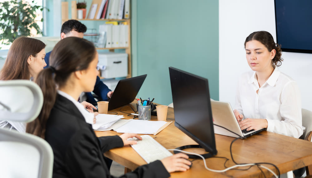 group of employees working in an office