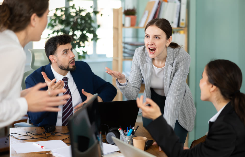 Team of employees got into an argument during an office meeting