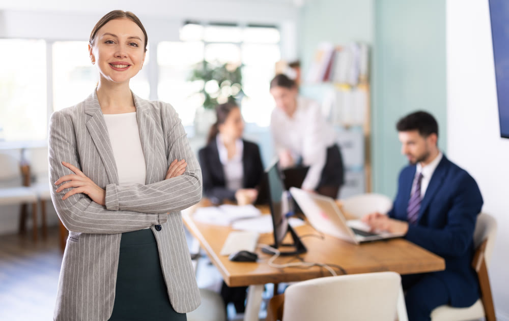 Young woman welcoming clients at workplace