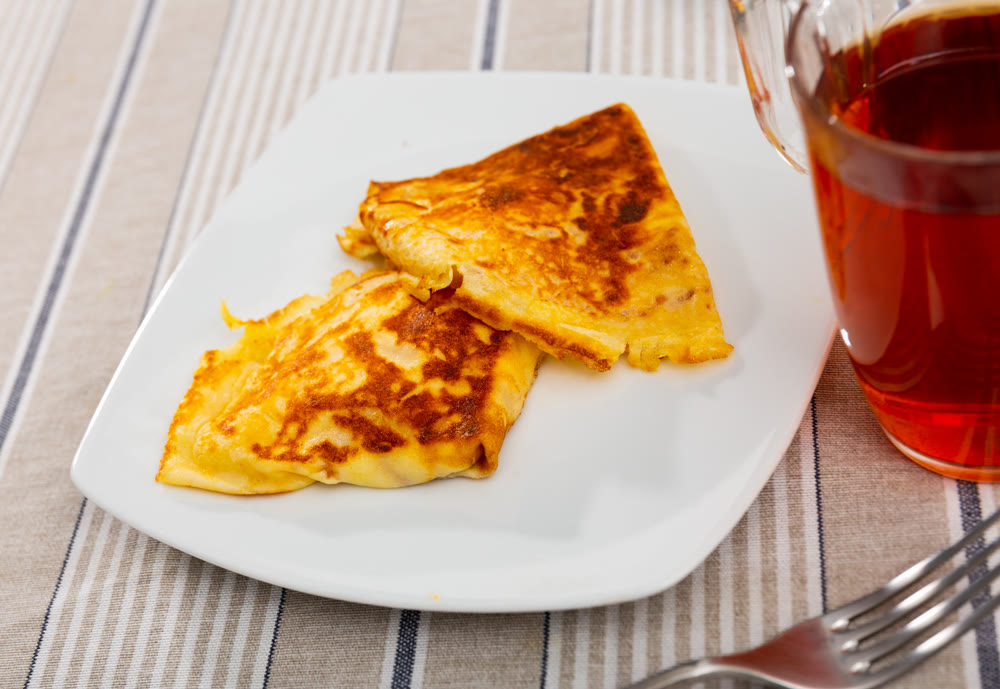 Delectable pancakes, featuring sweet fruit preserve filling