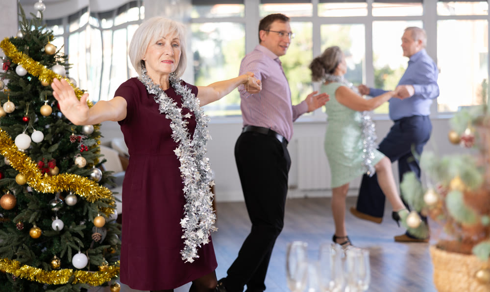 Adult man and elderly woman dance twist