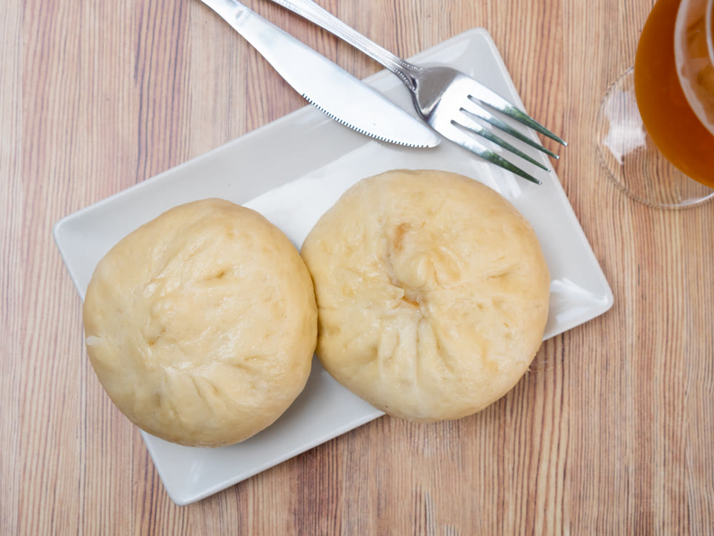 Steamed Chinese baozi Xiaolongbao on white plate