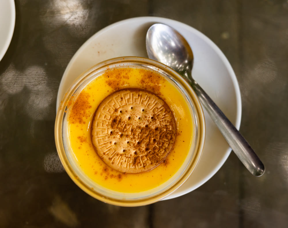 Delicate custard dessert made from milk, eggs and sugar, ornamented with soda biscuit.