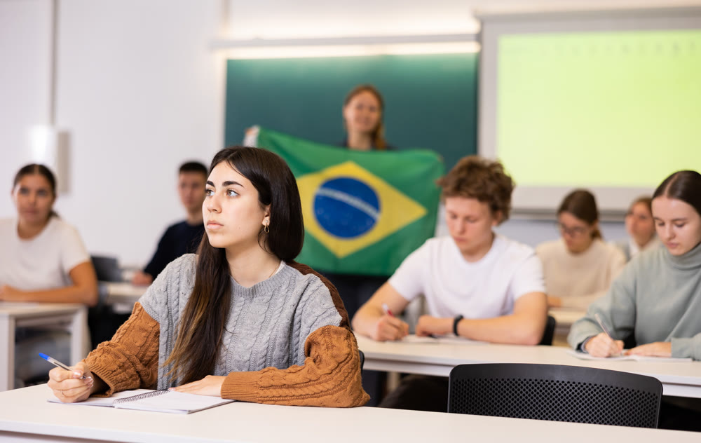 Young girl student diligently studies at school