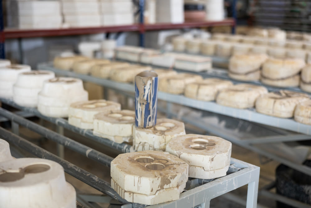 Lots of moulds for ceramic crockery in pottery workshop