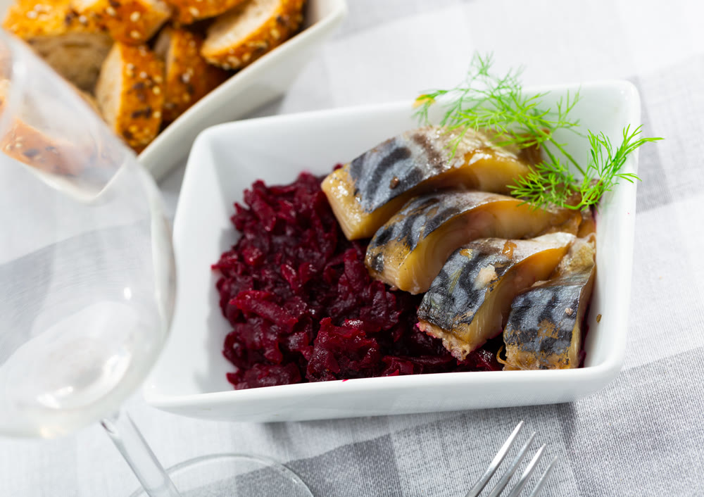 Pieces of scomber with beetroot served on plate