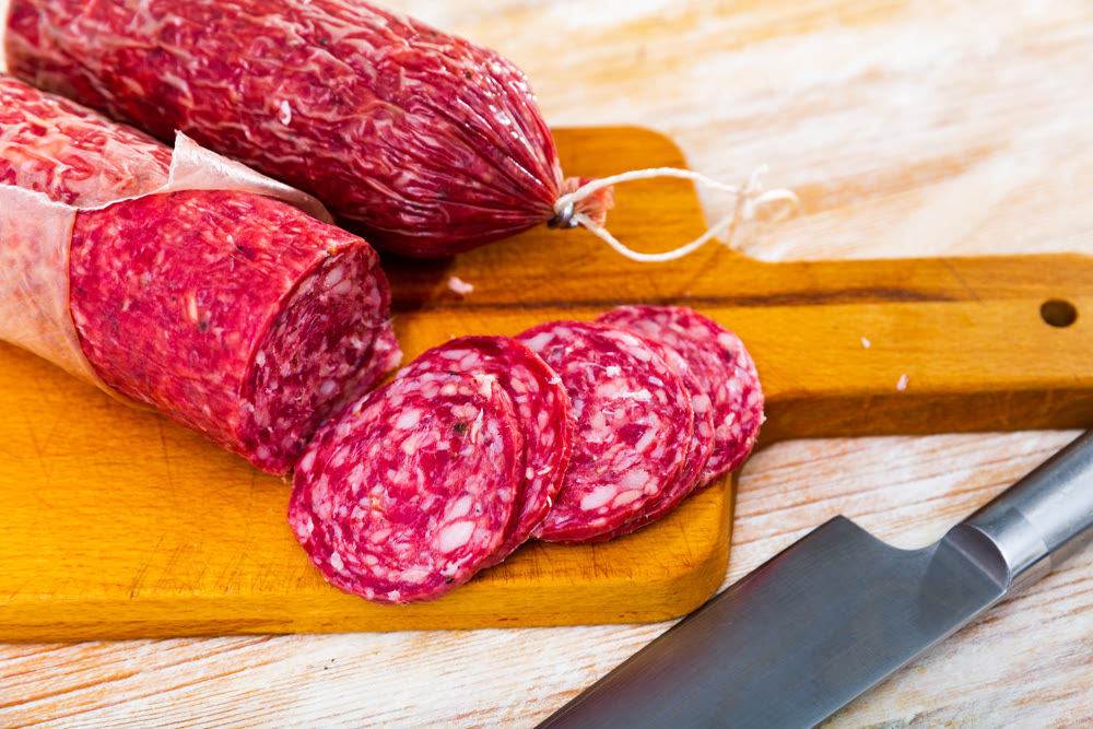 Slices of dry-cured sausage from Iberian pork seasoned with natural marinades