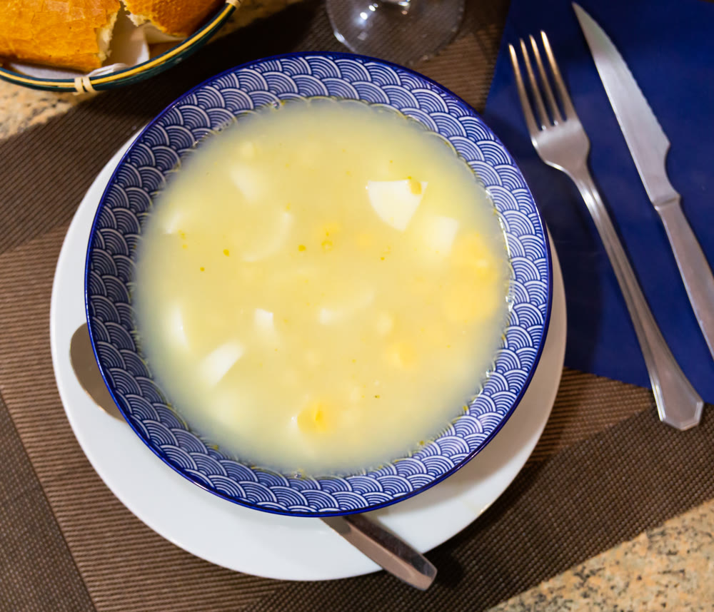 Soup is made from chicken broth, chopped boiled eggs and spices