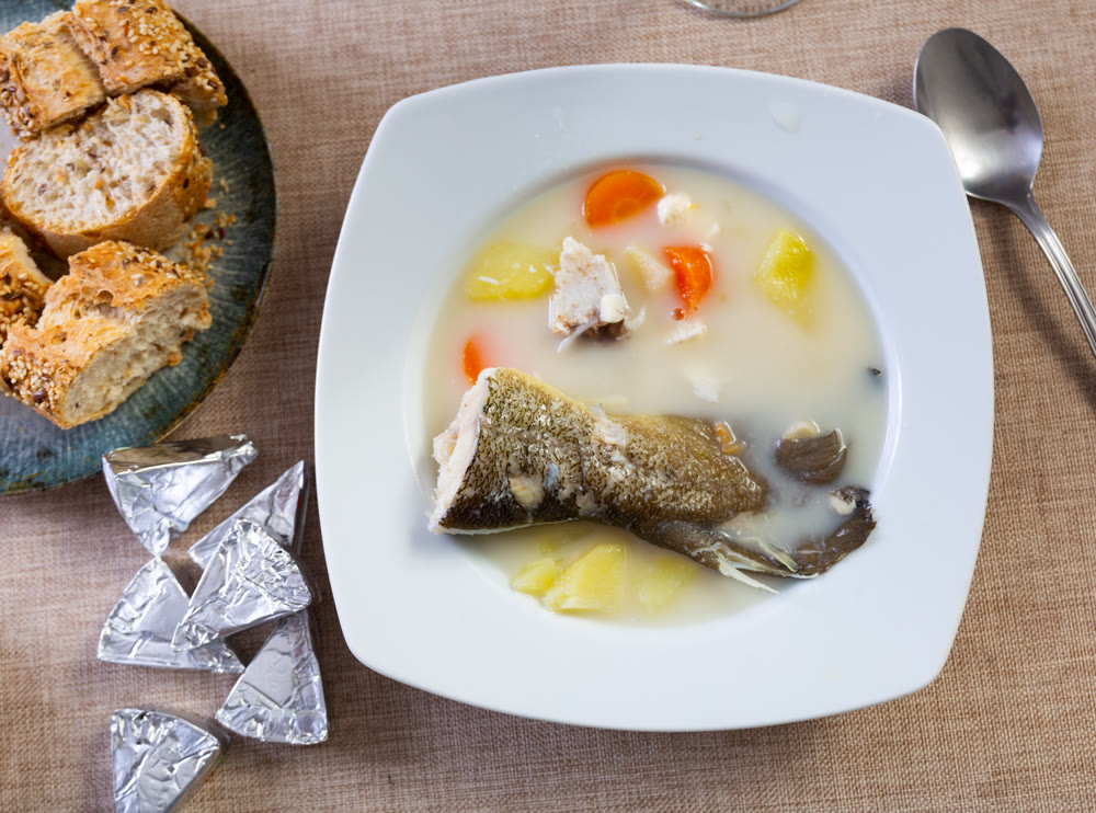 Cod and cheese soup served in bowl