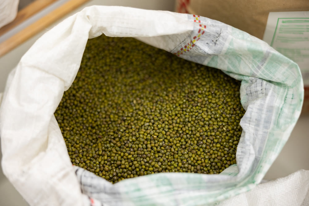 Sacks of green soybeans at food market