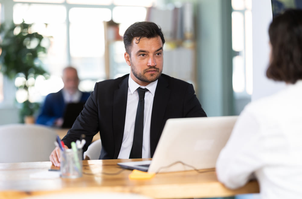 Bank manager talking with female client in office