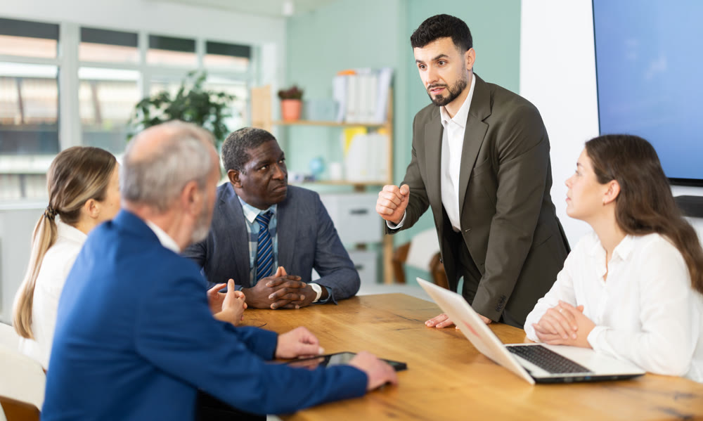 young man holding a meeting for the managers of the organization