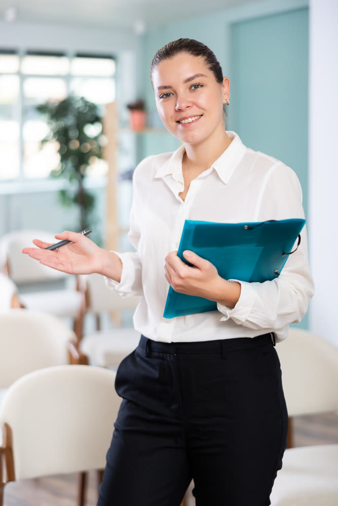 Secretary girl with paper document meet and invites visitors