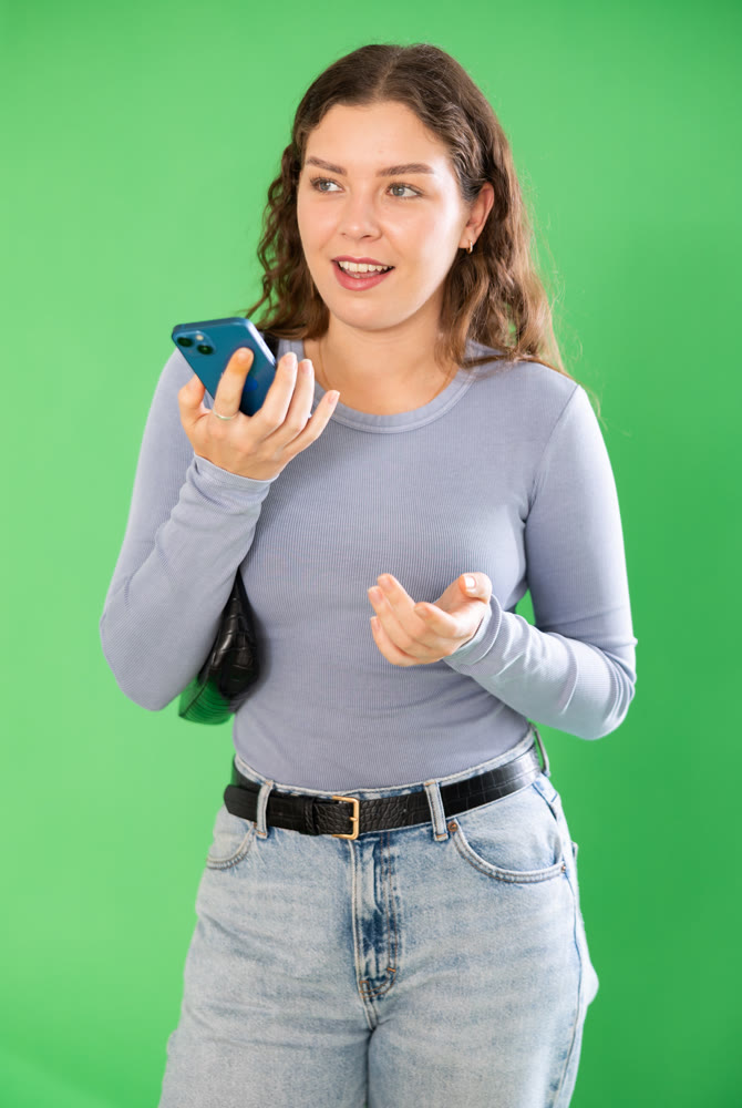Girl emotionally records a voice message to send via messenger. Chroma key compositing