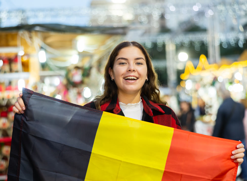 Girl with Belgium flag at new year street fair