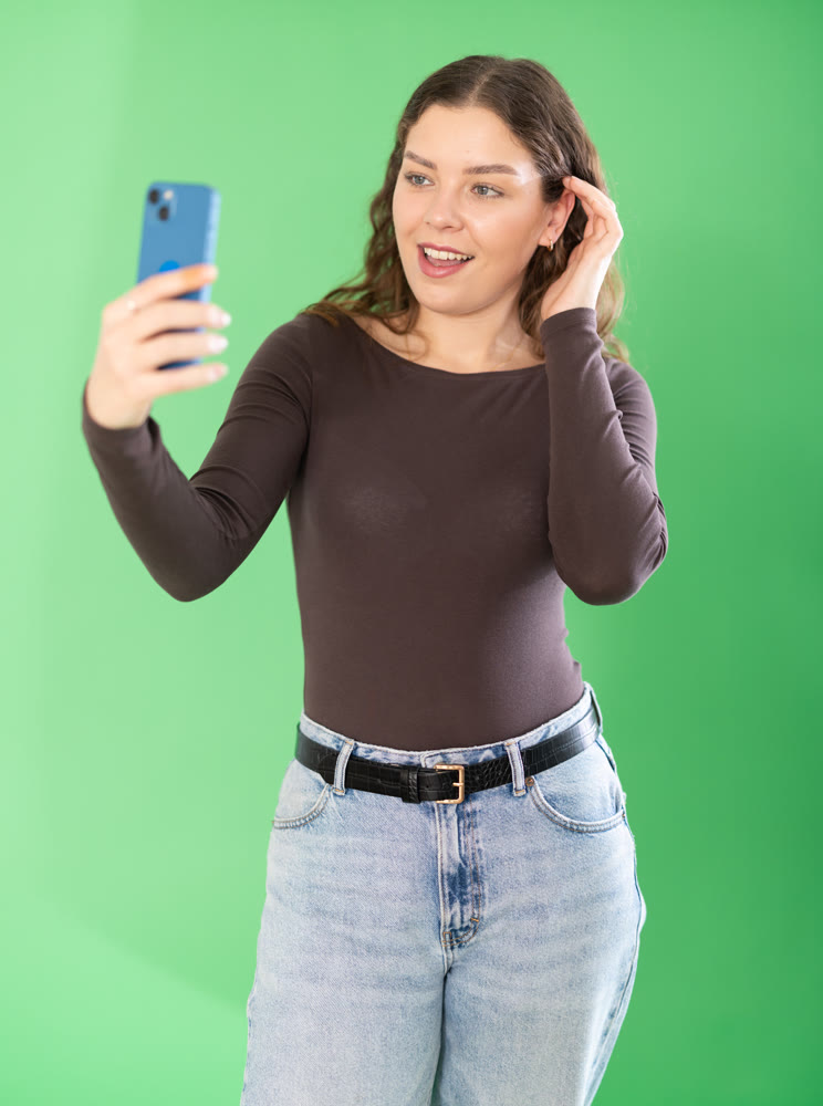 Girl takes selfie, captures herself in significant moment