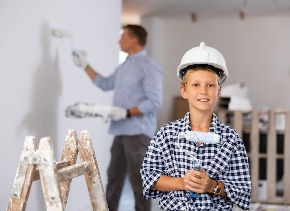 Boy posing with tools for home renovation