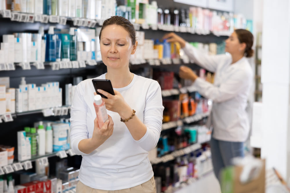 Adult woman looking for cosmetic product from photo on internet