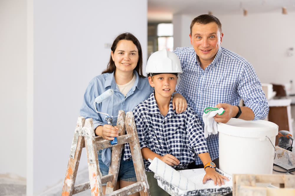 Portrait of cheerful family in new apartment