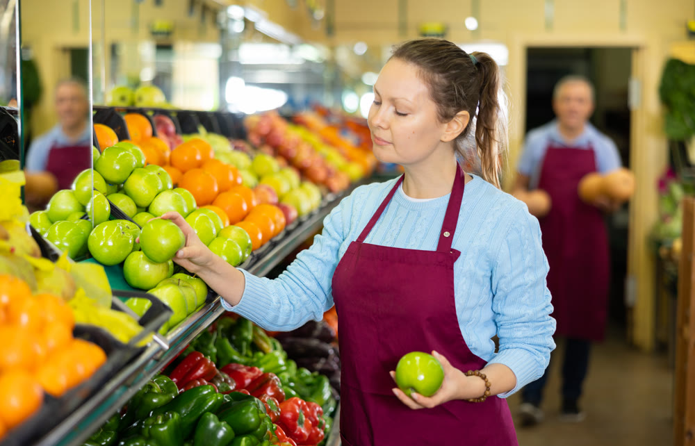 woman seller offers to buy apples