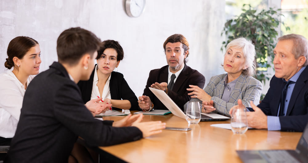 Businesspeople developing strategy for teamwork at table in office