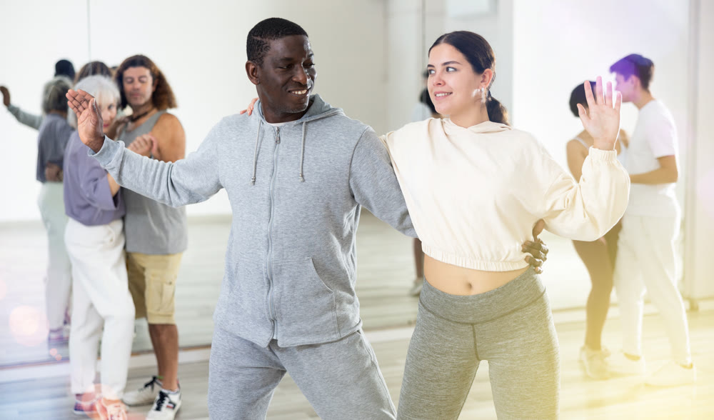 Dancing positive couples learning salsa