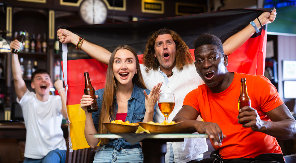 Germany sports fans supporting their favourite team in pub