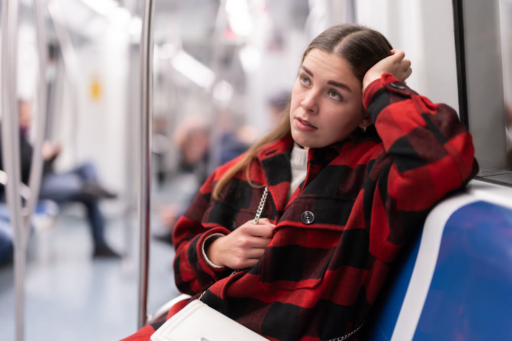 Tired woman returns to the subway