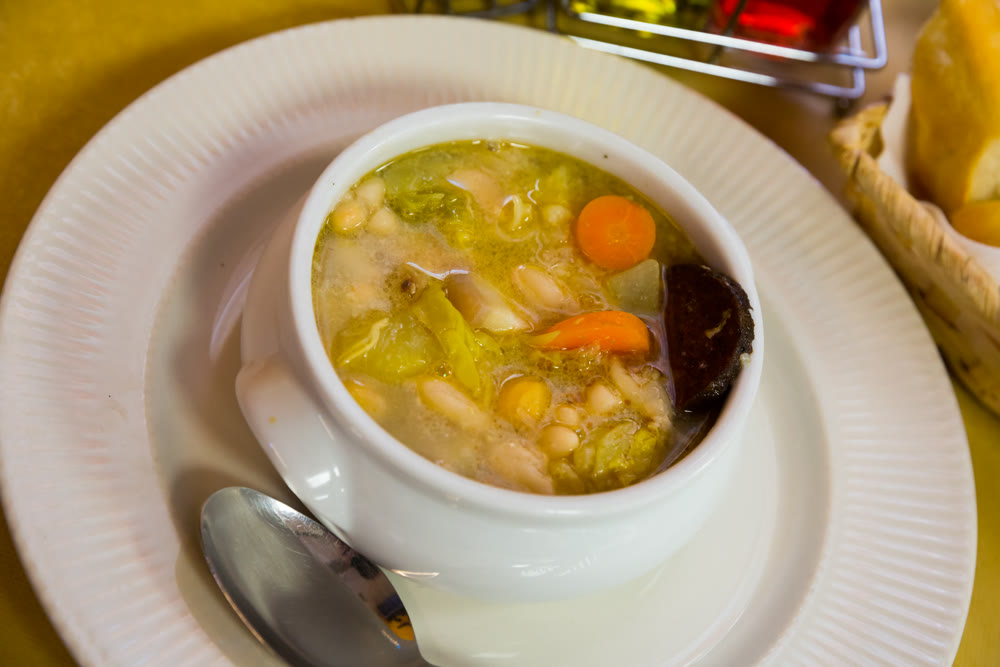 Catalan soup of bean with boiled carrots, potatoes and blood sausage