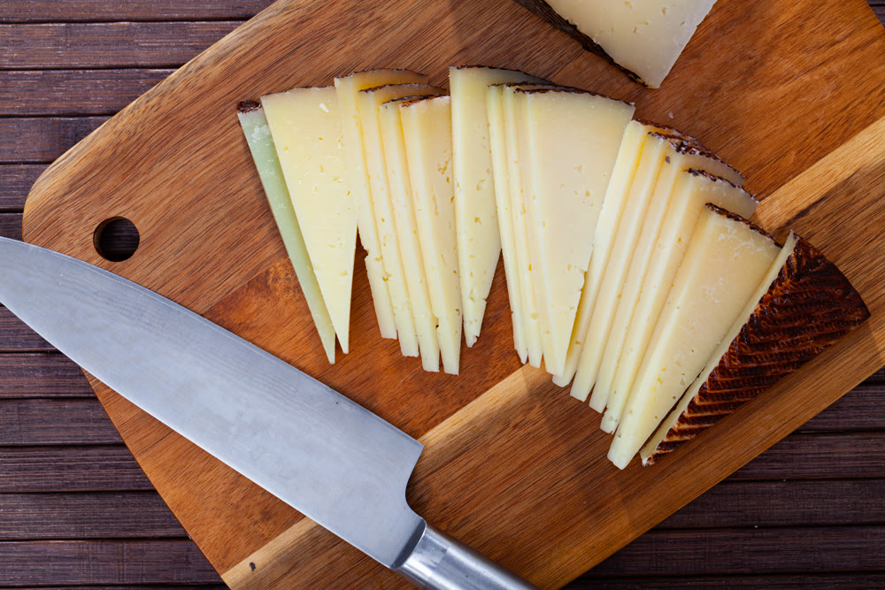 Slices of traditional Spanish aged sheep cheese